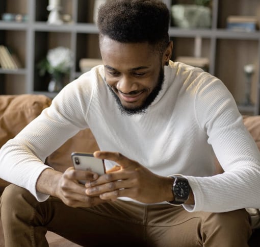 Photo of a man texting